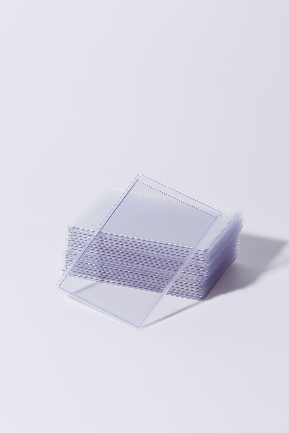 Stack of clear premium K-pop photocard toploaders